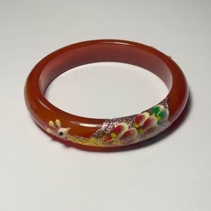 Homemade bengal, has a rose and peacock design. Size is 2.8 inches in diameter.